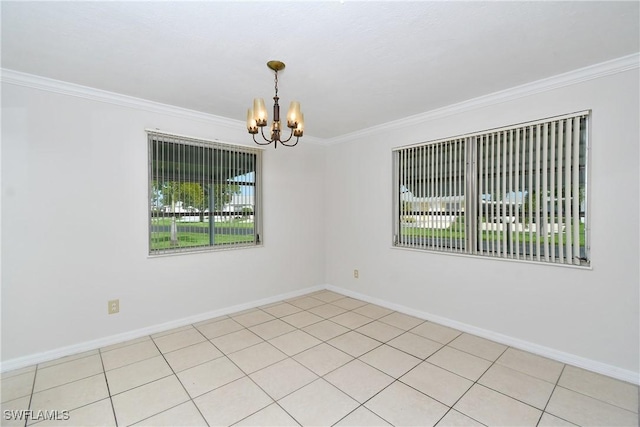 tiled spare room with ornamental molding and an inviting chandelier