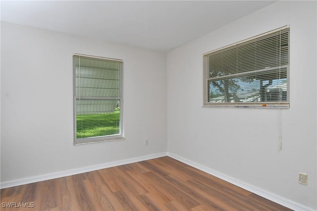 unfurnished room featuring hardwood / wood-style floors