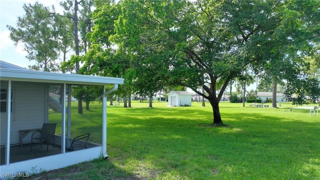 view of yard featuring a sunroom