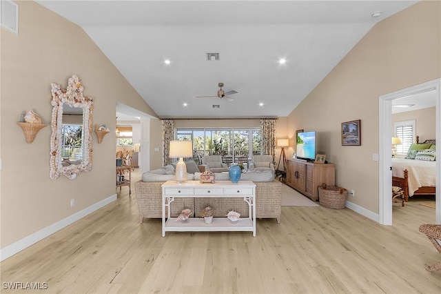 bedroom featuring high vaulted ceiling and light hardwood / wood-style flooring