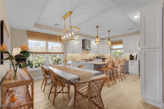 dining space featuring sink and light hardwood / wood-style floors