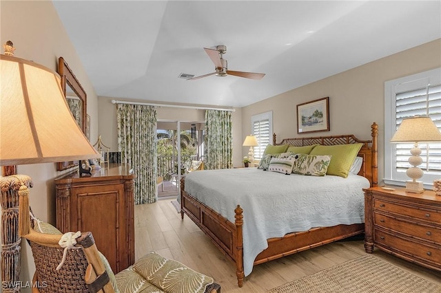 bedroom featuring ceiling fan, access to exterior, and light hardwood / wood-style floors