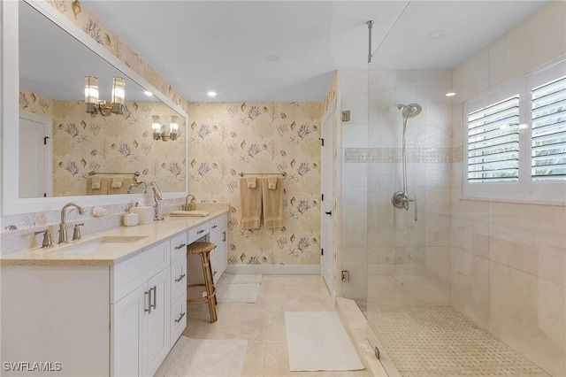 bathroom featuring vanity, a shower with shower door, and tile patterned floors