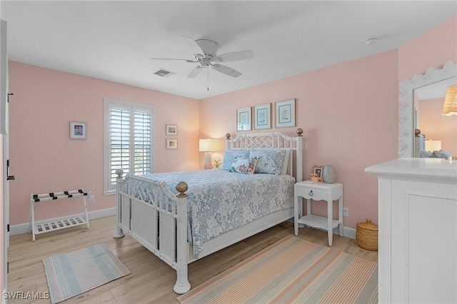 bedroom with ceiling fan and light wood-type flooring