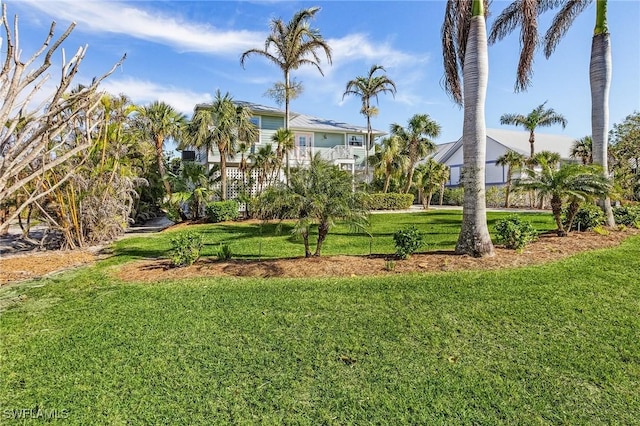 view of yard with a balcony