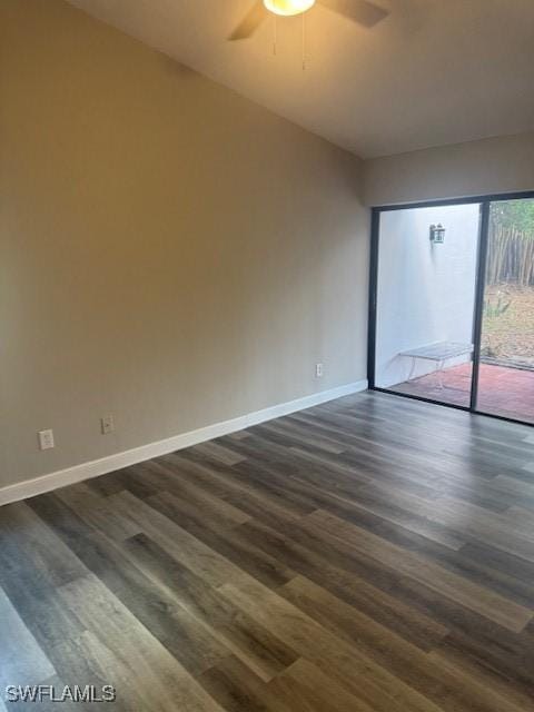 spare room featuring ceiling fan and dark hardwood / wood-style flooring