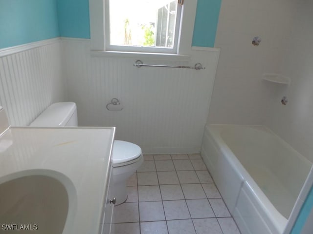 bathroom with tile patterned floors, toilet, and vanity