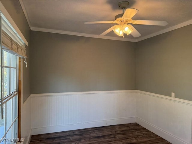 spare room with crown molding, dark hardwood / wood-style floors, and ceiling fan