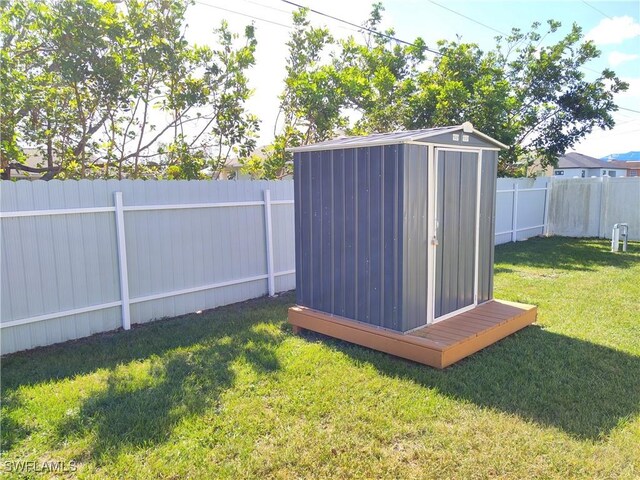 view of outdoor structure featuring a lawn