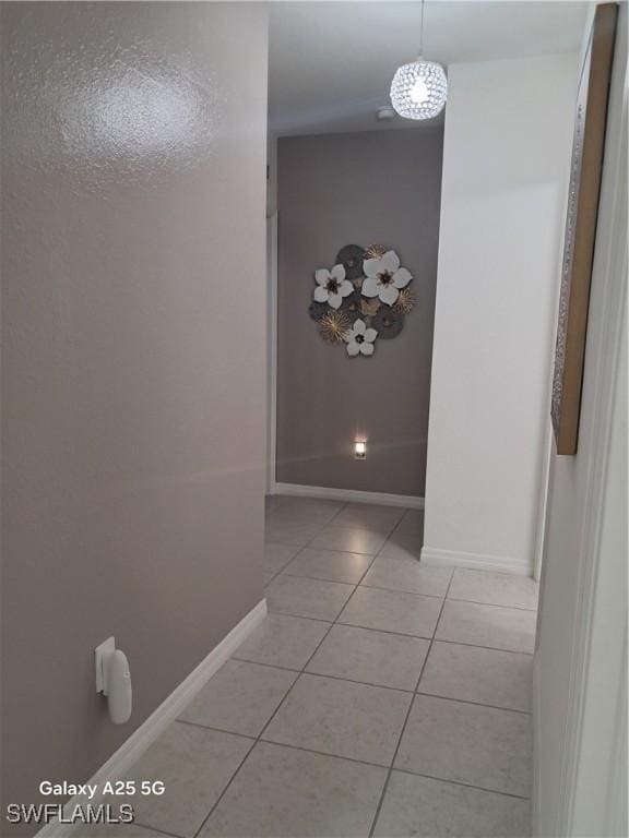 hall featuring light tile patterned floors