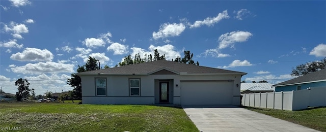 view of front facade featuring a garage and a front lawn