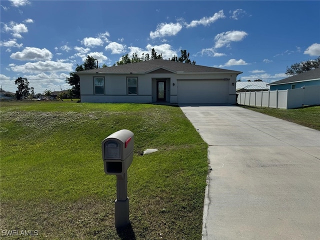 view of front of home with a garage and a front lawn