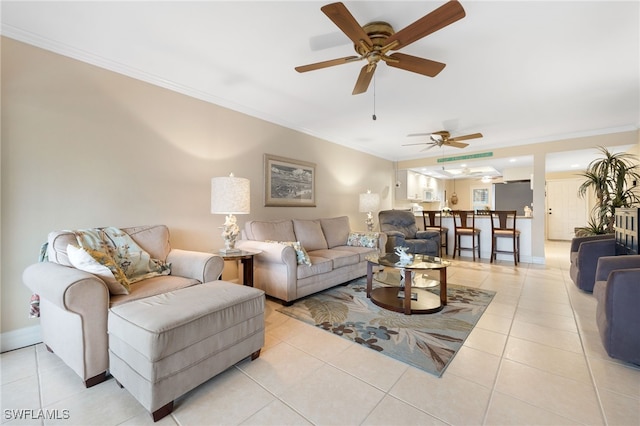 902 SW 48th Ter Unit 104, Cape Coral, FL 33914 - living area featuring crown molding, a ceiling fan, light tile patterned floors, and baseboards