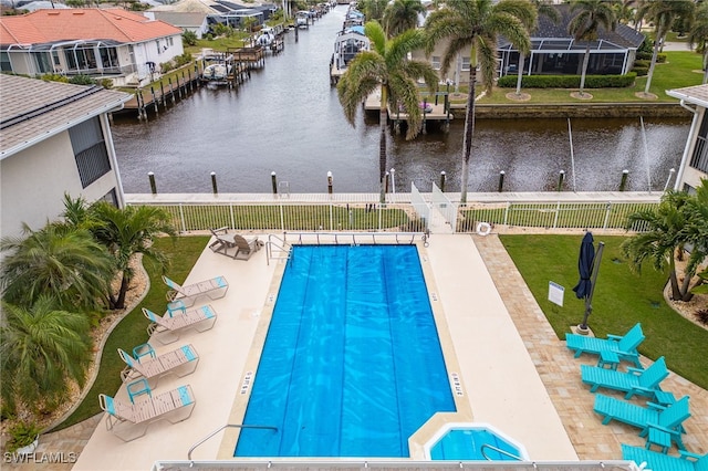 902 SW 48th Ter Unit 104, Cape Coral, FL 33914 - community pool featuring a water view, fence, and a residential view