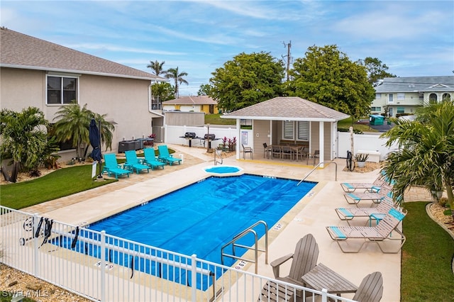 902 SW 48th Ter Unit 104, Cape Coral, FL 33914 - community pool with fence, a patio area, and an outdoor structure