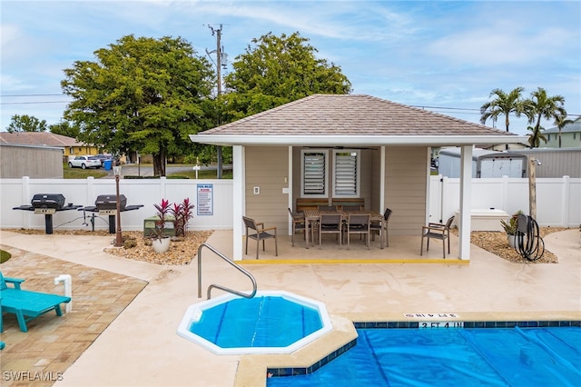 902 SW 48th Ter Unit 104, Cape Coral, FL 33914 - community pool with a patio, an outbuilding, fence, and area for grilling