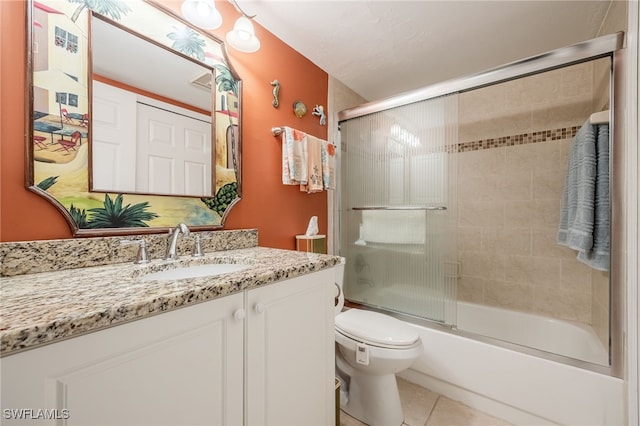 902 SW 48th Ter Unit 104, Cape Coral, FL 33914 - full bathroom with vanity, tile patterned flooring, toilet, and bath / shower combo with glass door