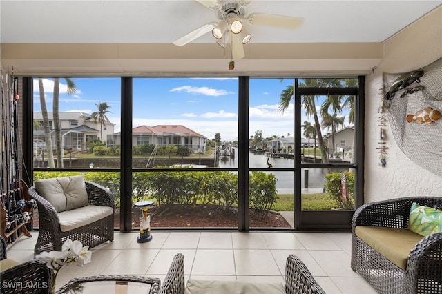 902 SW 48th Ter Unit 104, Cape Coral, FL 33914 - sunroom with a water view, a ceiling fan, and plenty of natural light