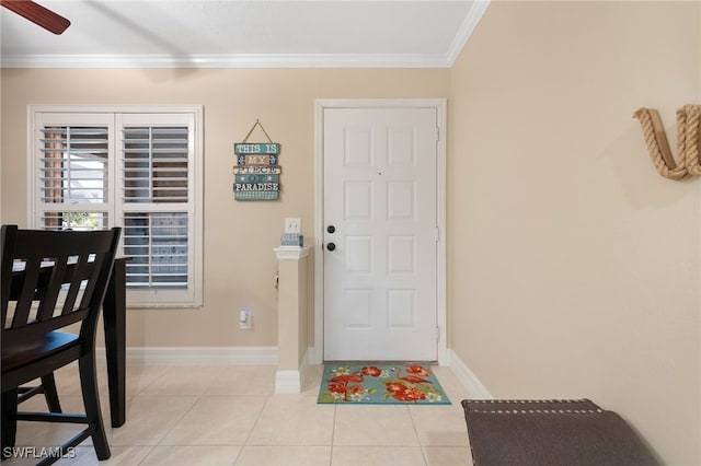 902 SW 48th Ter Unit 104, Cape Coral, FL 33914 - entryway featuring crown molding, light tile patterned floors, baseboards, and a ceiling fan