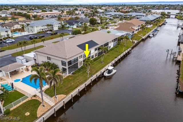 bird's eye view with a residential view and a water view