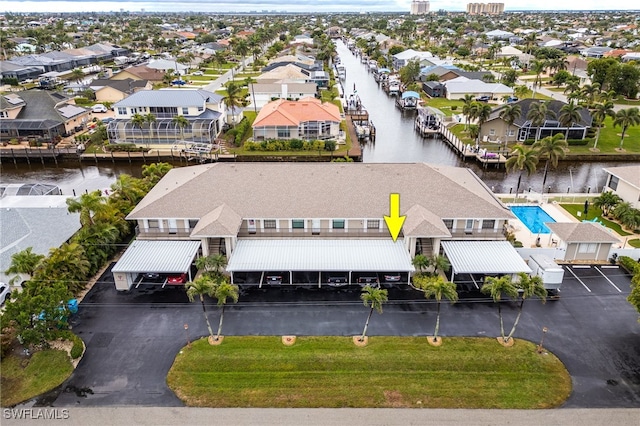 aerial view with a residential view and a water view