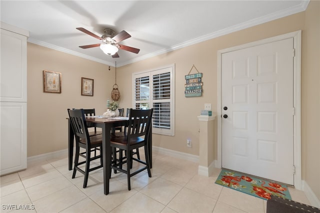 902 SW 48th Ter Unit 104, Cape Coral, FL 33914 - dining space featuring a ceiling fan, crown molding, light tile patterned flooring, and baseboards
