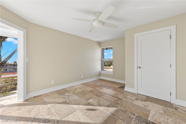 spare room with ceiling fan