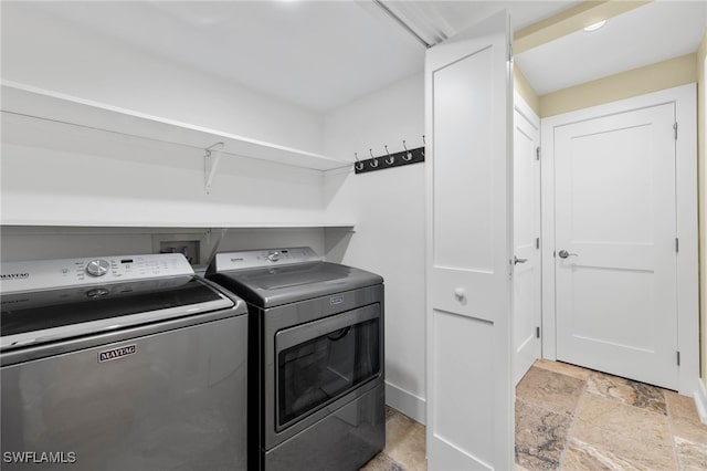 clothes washing area featuring washing machine and dryer