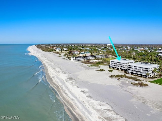 aerial view featuring a water view and a beach view