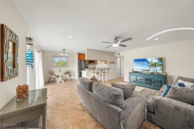 living room featuring light tile patterned flooring and ceiling fan