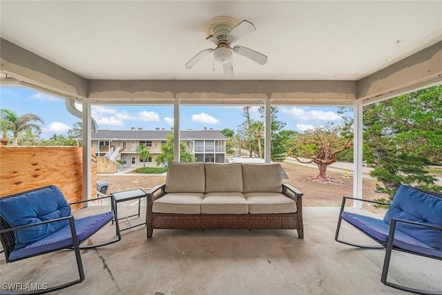 sunroom / solarium with a wealth of natural light and ceiling fan