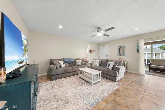 living room with ceiling fan and light tile patterned floors