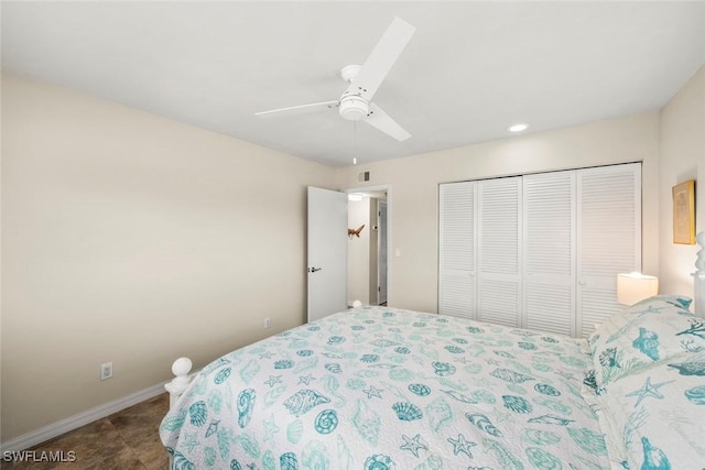 bedroom with ceiling fan and a closet