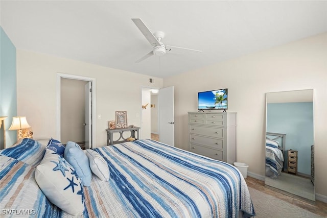 bedroom featuring ceiling fan and light colored carpet