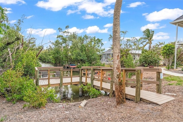 exterior space with a water view and a lanai