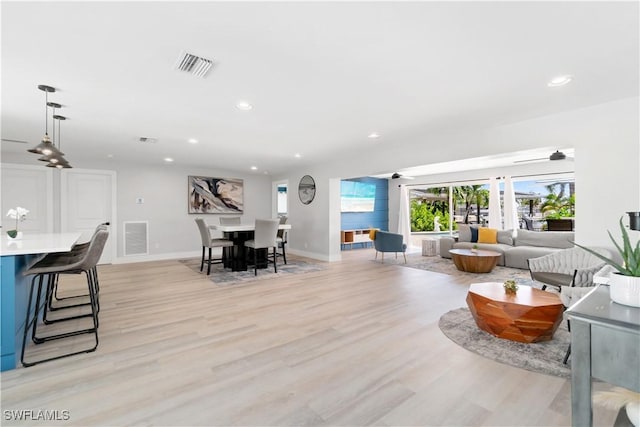 living room with light hardwood / wood-style flooring