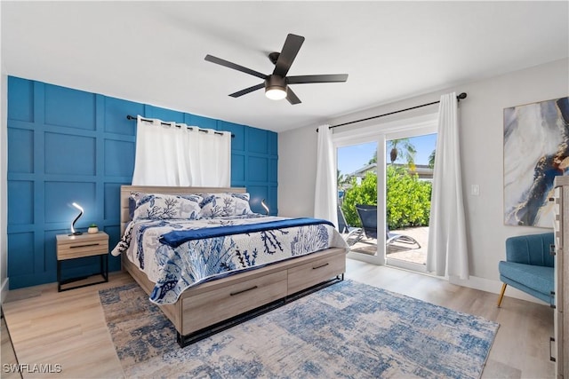 bedroom with access to exterior, light hardwood / wood-style floors, and ceiling fan