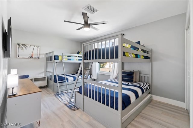 bedroom featuring hardwood / wood-style flooring and ceiling fan