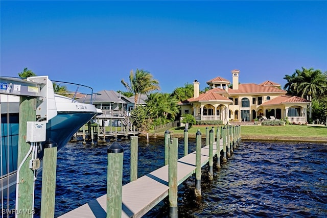 view of dock with a water view and boat lift