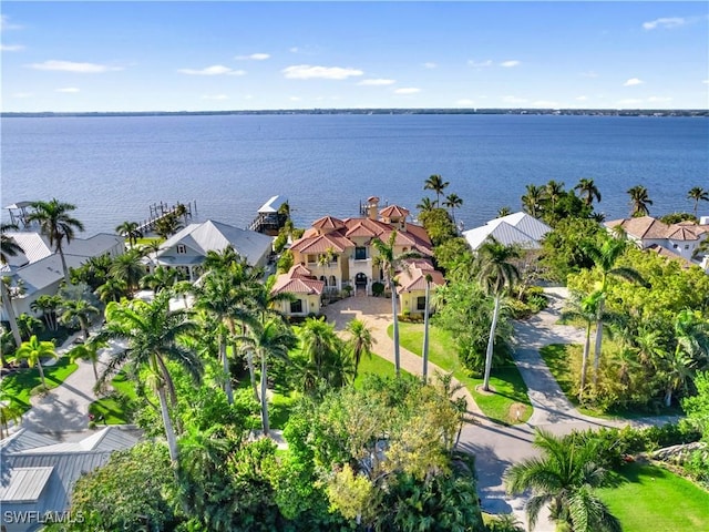 drone / aerial view featuring a water view and a residential view