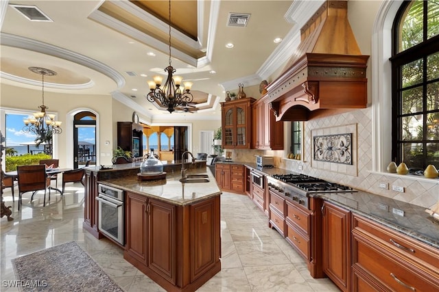 2704 Shriver Dr, Fort Myers, FL 33901 - kitchen with visible vents, a tray ceiling, and a notable chandelier