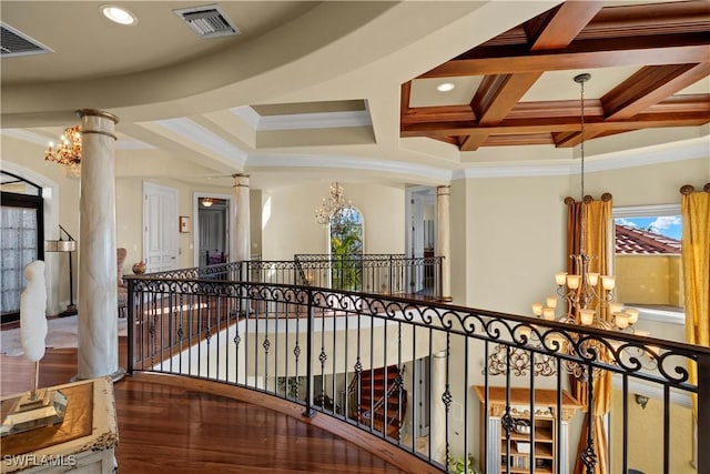 2704 Shriver Dr, Fort Myers, FL 33901 - hall featuring decorative columns, visible vents, coffered ceiling, and a notable chandelier
