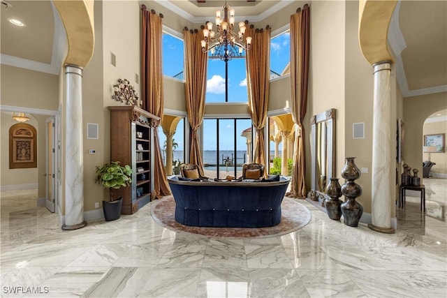 2704 Shriver Dr, Fort Myers, FL 33901 - interior space featuring arched walkways, marble finish floor, ornamental molding, and plenty of natural light