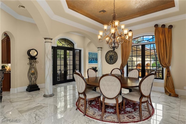 2704 Shriver Dr, Fort Myers, FL 33901 - dining area with arched walkways, a tray ceiling, and visible vents
