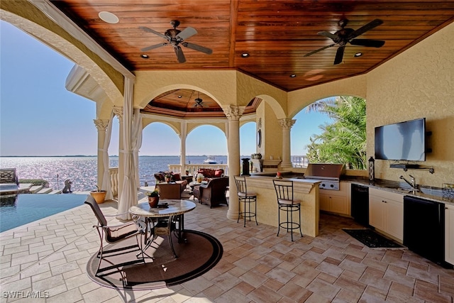 2704 Shriver Dr, Fort Myers, FL 33901 - view of patio with exterior kitchen, a grill, a sink, and ceiling fan