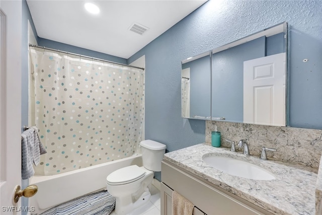 full bathroom featuring vanity, toilet, and shower / tub combo with curtain