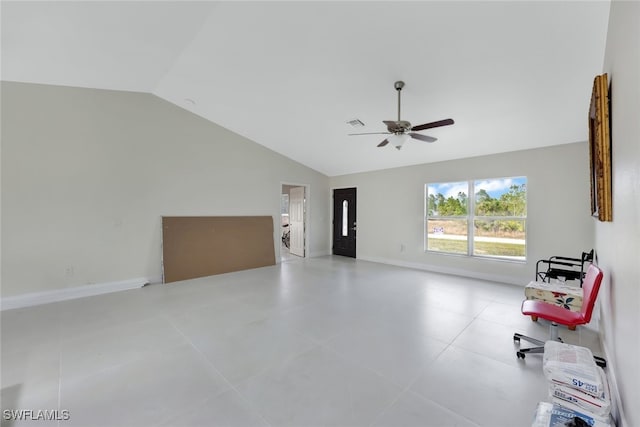 interior space featuring light tile patterned flooring, vaulted ceiling, and ceiling fan