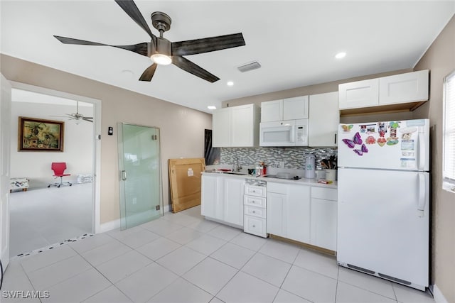 kitchen featuring white appliances, white cabinetry, tasteful backsplash, light tile patterned flooring, and ceiling fan