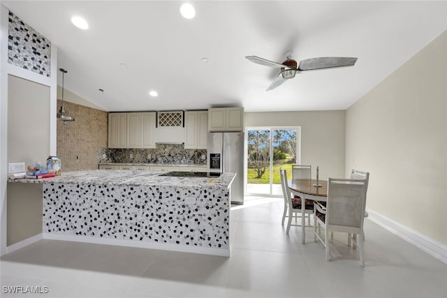 kitchen with kitchen peninsula, backsplash, pendant lighting, and stainless steel fridge with ice dispenser