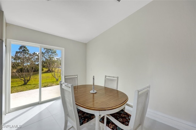 dining space featuring light tile patterned floors